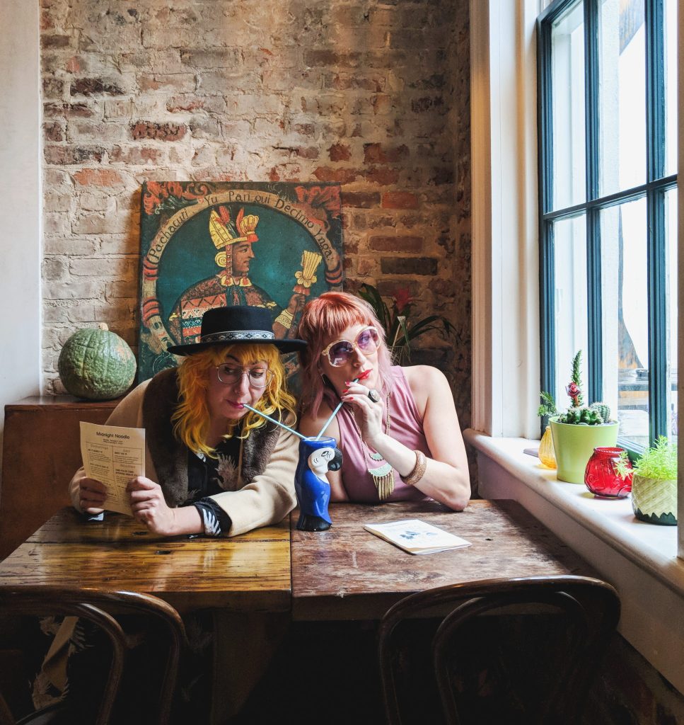 The Traveler Broads share a tropical cocktail called the Judgey Parrot at the New Orleans Catahoula Hotel.