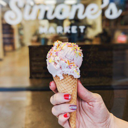 Roasted Strawberry Creole ice cream cone with sprinkles from Simone's Market, New Orleans' grocery wonderland.