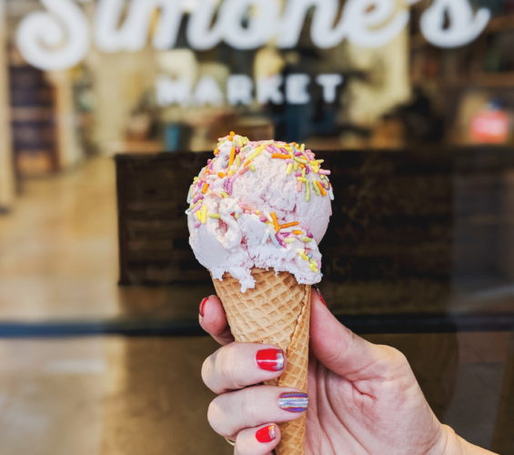 Roasted Strawberry Creole ice cream cone with sprinkles from Simone's Market, New Orleans' grocery wonderland.